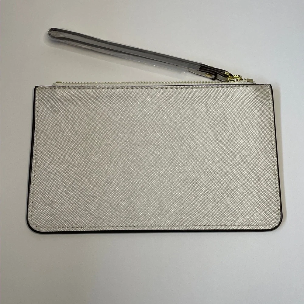 NWT Kate Spade cream saffiano wristlet with gold logo.  8x5” - Picture 3 of 7